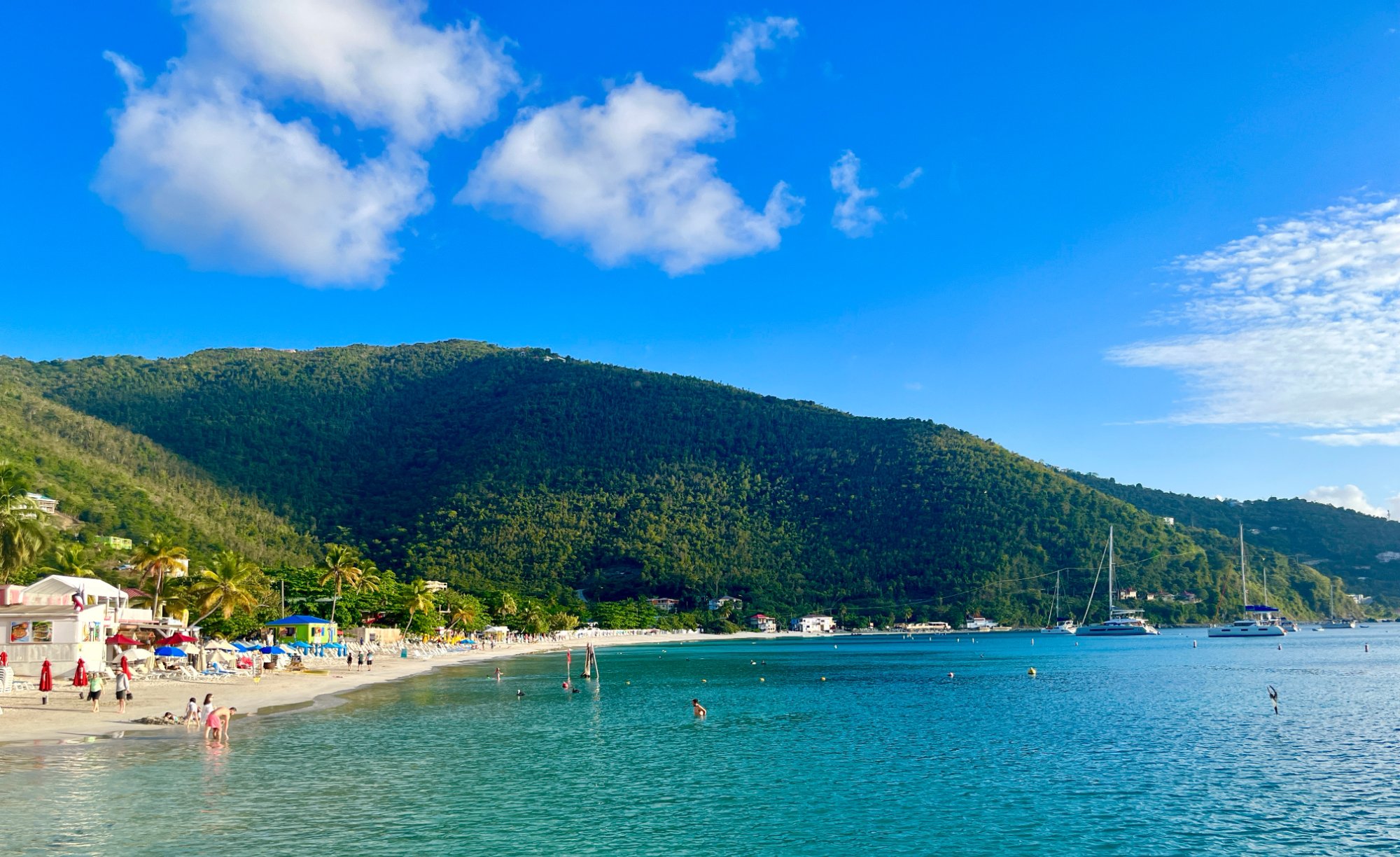 Cane Garden Bay Tortola BVI beach with catamarans anchored in turquoise water