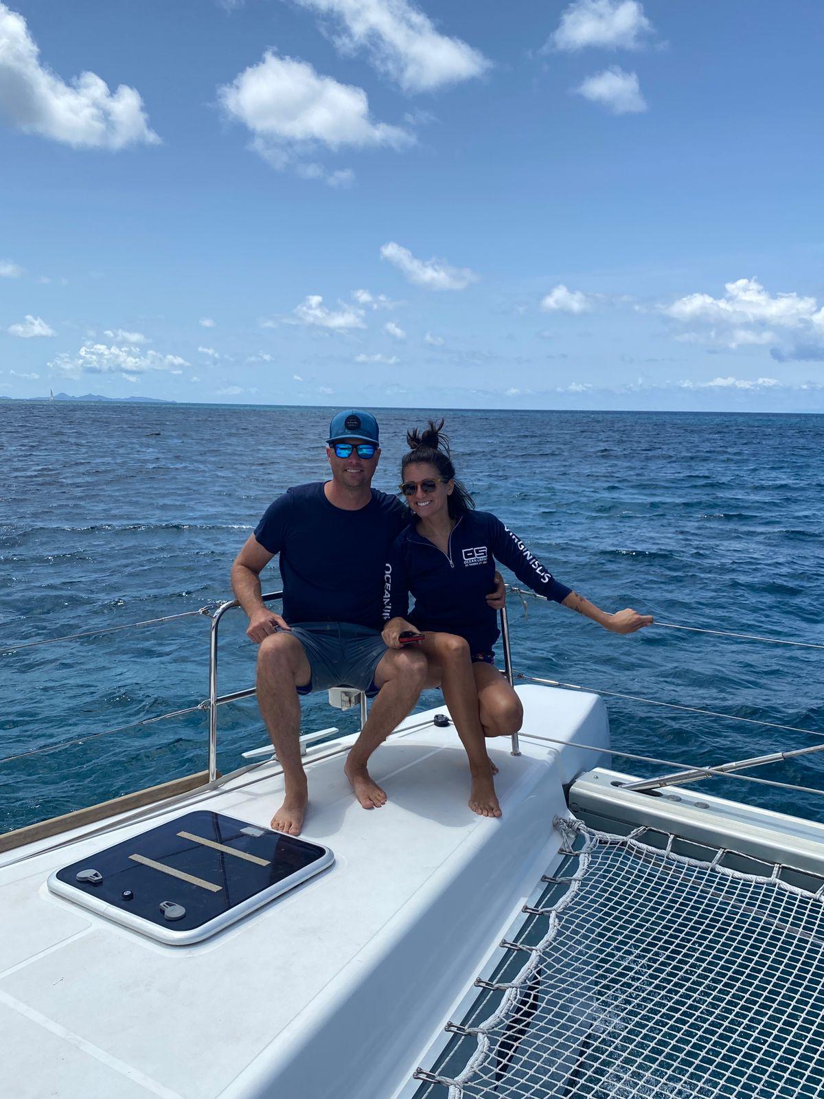 Nikki and Tyler on the bow of S/V Elation sailing the BVI